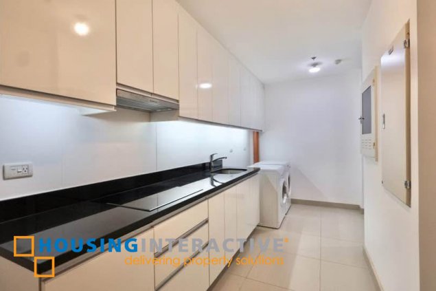semi-furnished 3br unit with parking for rent in two roxas triangle
