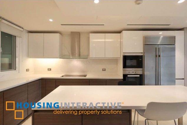 semi-furnished 3br unit with parking for rent in two roxas triangle