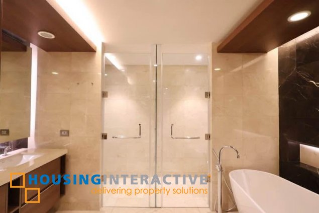 semi-furnished 3br unit with parking for rent in two roxas triangle