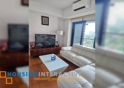semi-furnished 2br unit with parking for sale in one rockwell