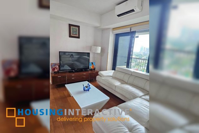 semi-furnished 2br unit with parking for sale in one rockwell