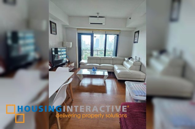 semi-furnished 2br unit with parking for sale in one rockwell