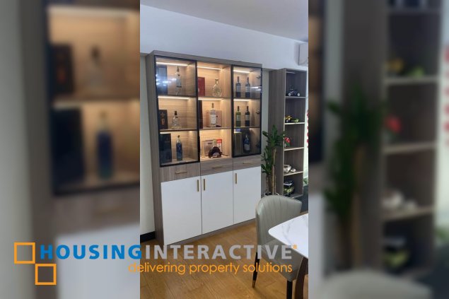 fully furnished 2br unit with parking for sale in one serendra