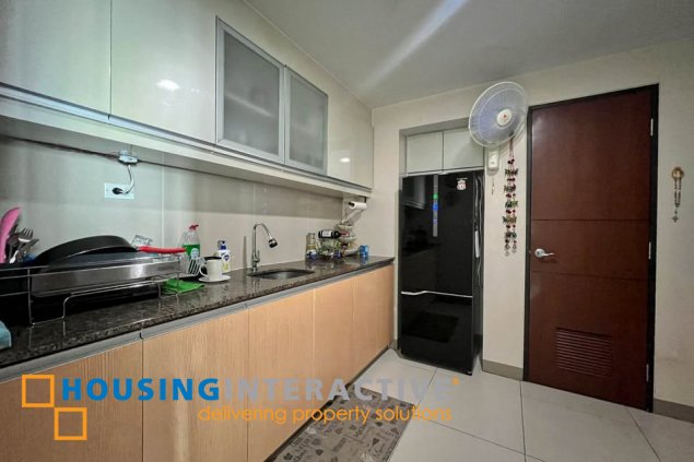 semi-furnished 2br unit with parking for sale in one uptown residences