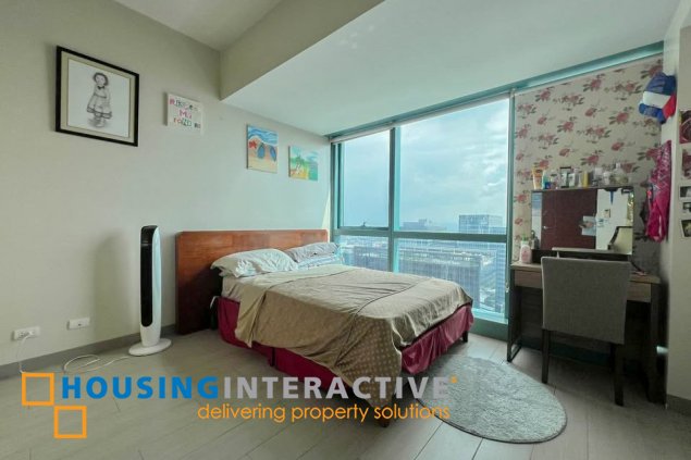 semi-furnished 2br unit with parking for sale in one uptown residences