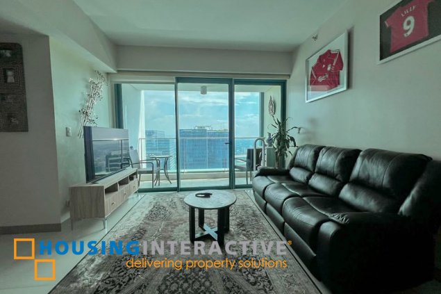 semi-furnished 2br unit with parking for sale in one uptown residences