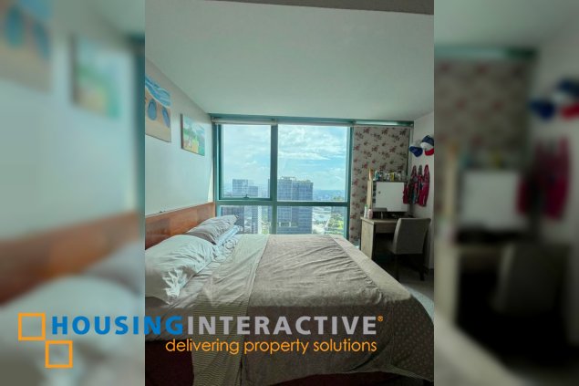 semi-furnished 2br unit with parking for sale in one uptown residences