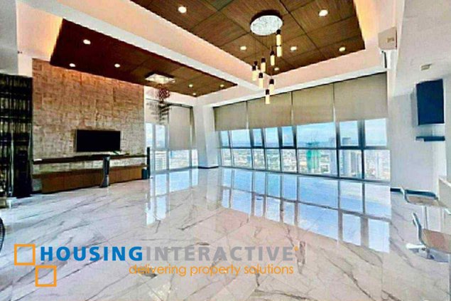 semi-furnished 4br penthouse unit with parking for sale in st. francis shangri-la place