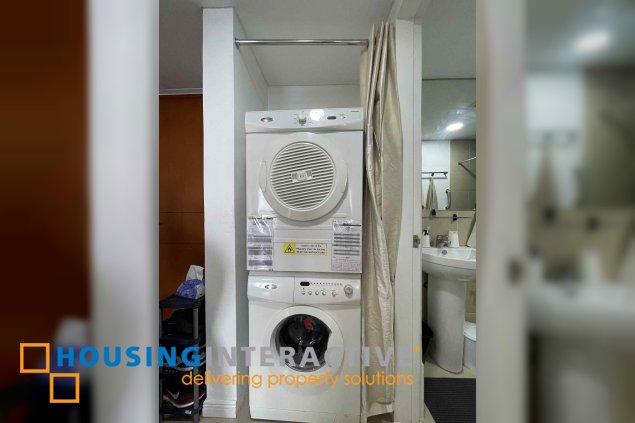 semi-furnished 1br unit with parking for sale in the infinity tower