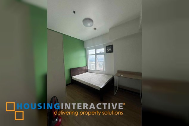 fully furnished 2br unit with parking for sale in two serendra