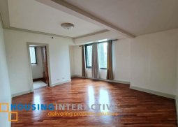 semi-furnished 2br unit with balcony and parking for lease in amorsolo square