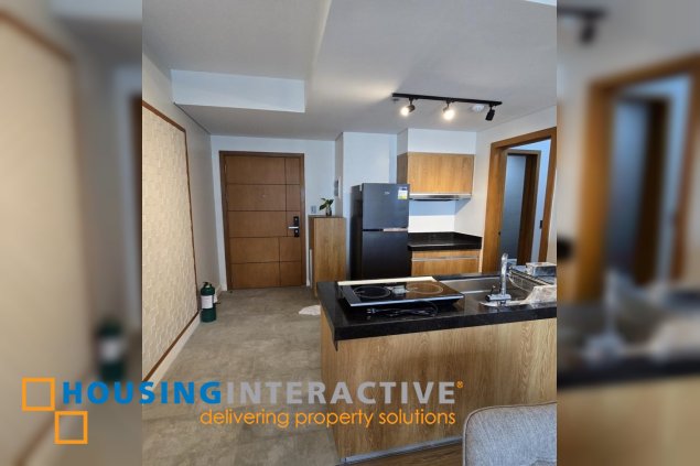 nicely furnished 2br with parking for lease in natsu tower, bgc