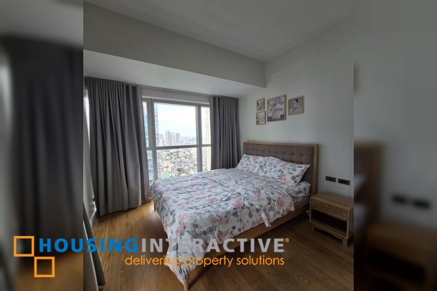 nicely furnished 2br with parking for lease in natsu tower, bgc