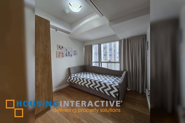 nicely furnished 2br with parking for lease in natsu tower, bgc