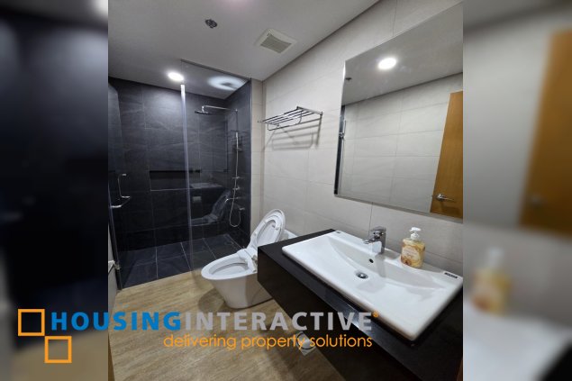 nicely furnished 2br with parking for lease in natsu tower, bgc